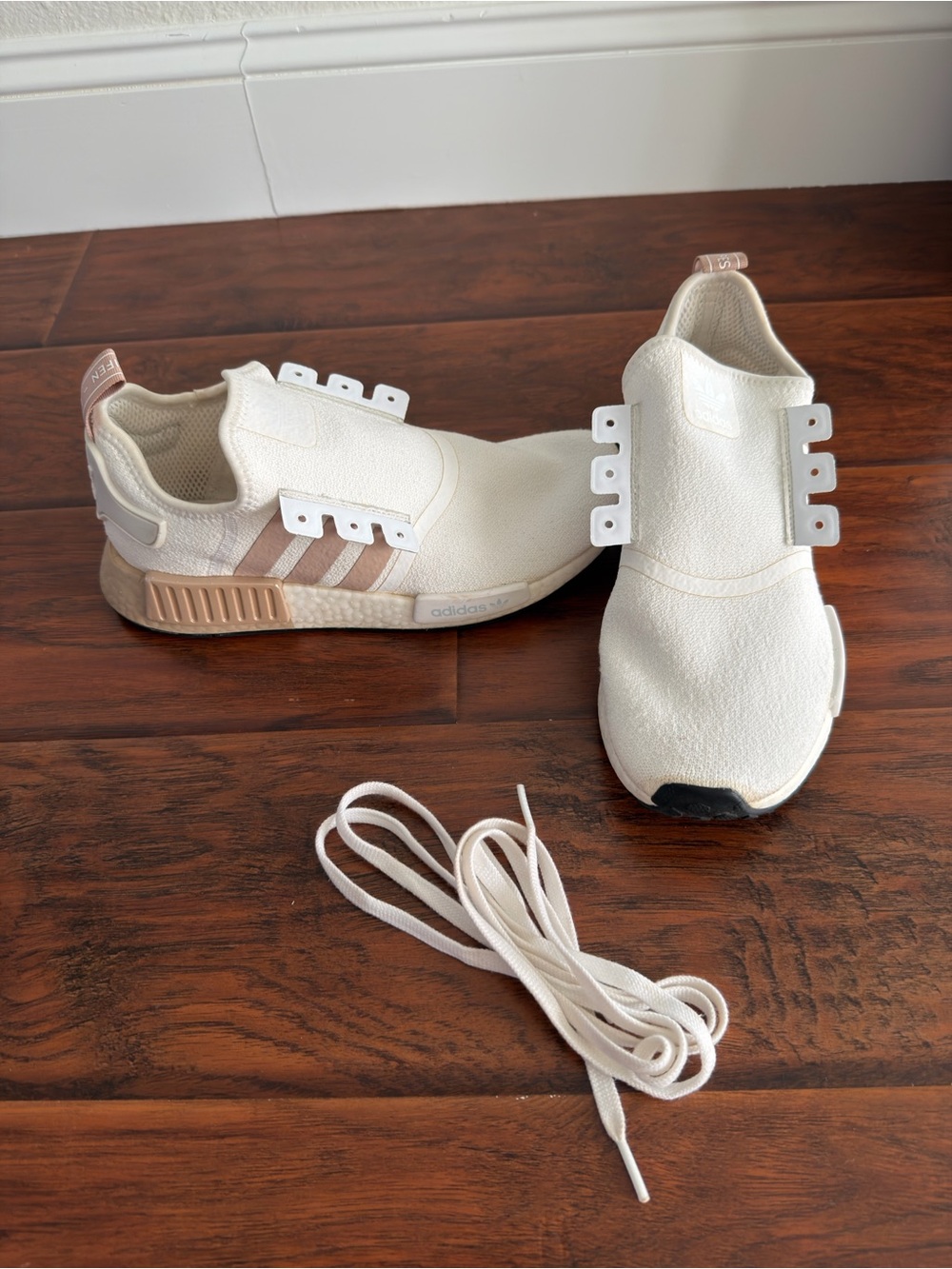 Adidas Woman’s Slip-On Sneakers in Off-White with Blush Accents